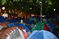 Rain falls on the tents of Occupy Wall Street protesters in Zuccotti Park on Saturday evening. 